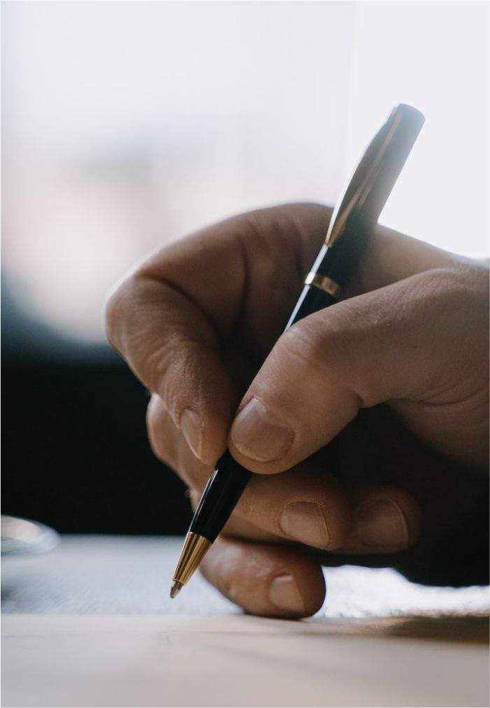 person-writting-on-paper_compressed